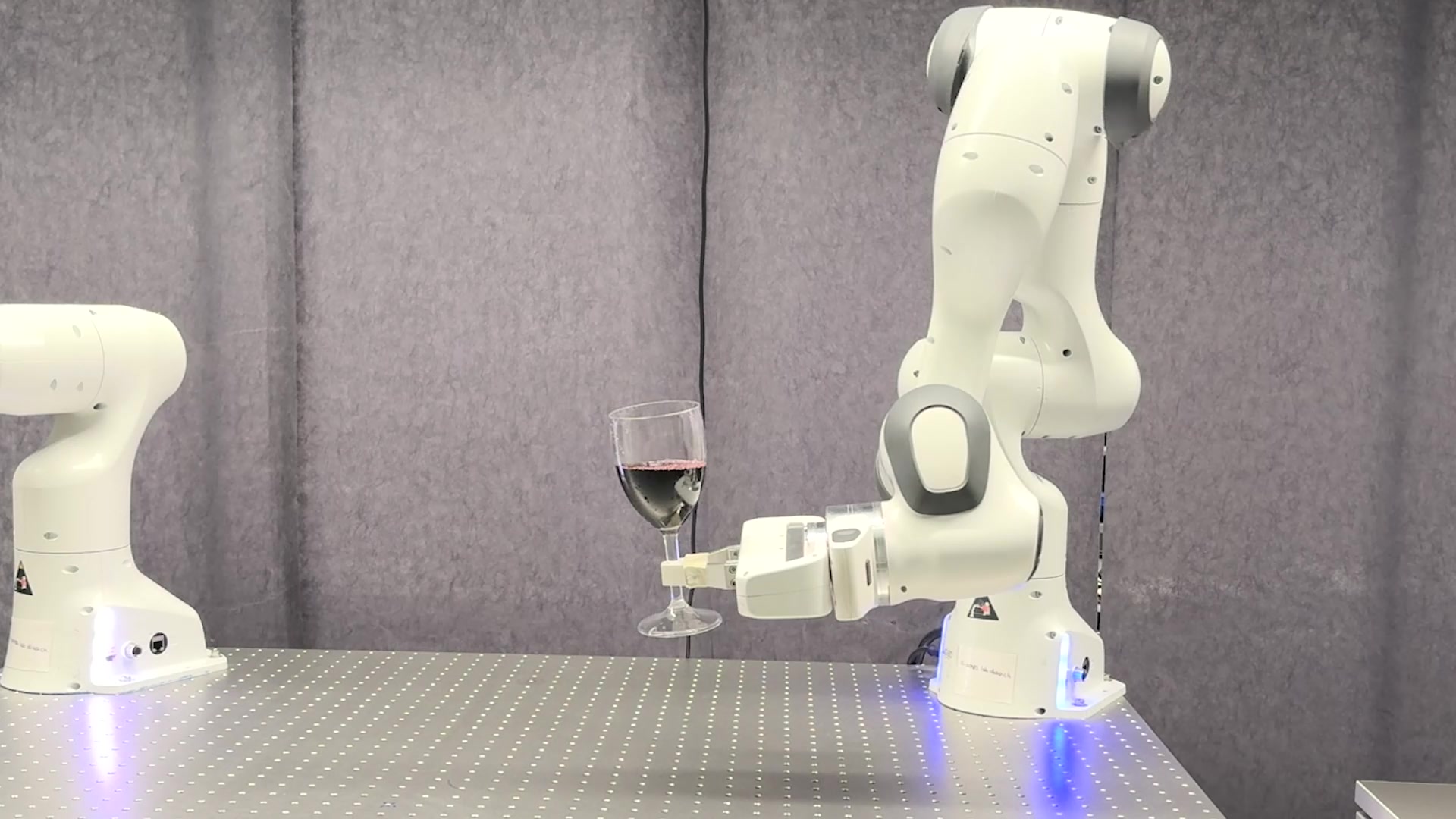 Robot holding a wine glass in the Spline Policy demonstration